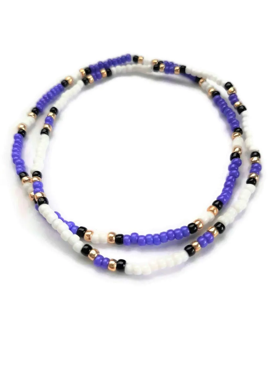 Purple, black, gold, and white stacking stretch anklets. Seed bead elastic cord ankle bracelets. Set of 2.